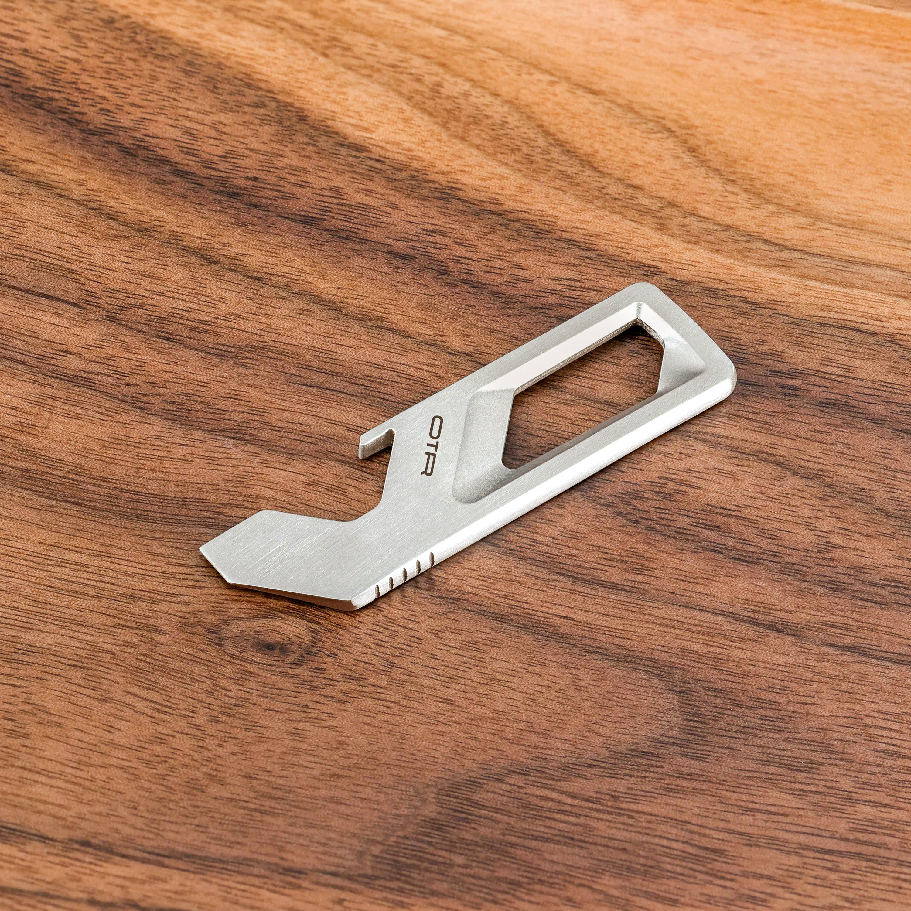 Brushed Stainless Steel Multitool on Wood