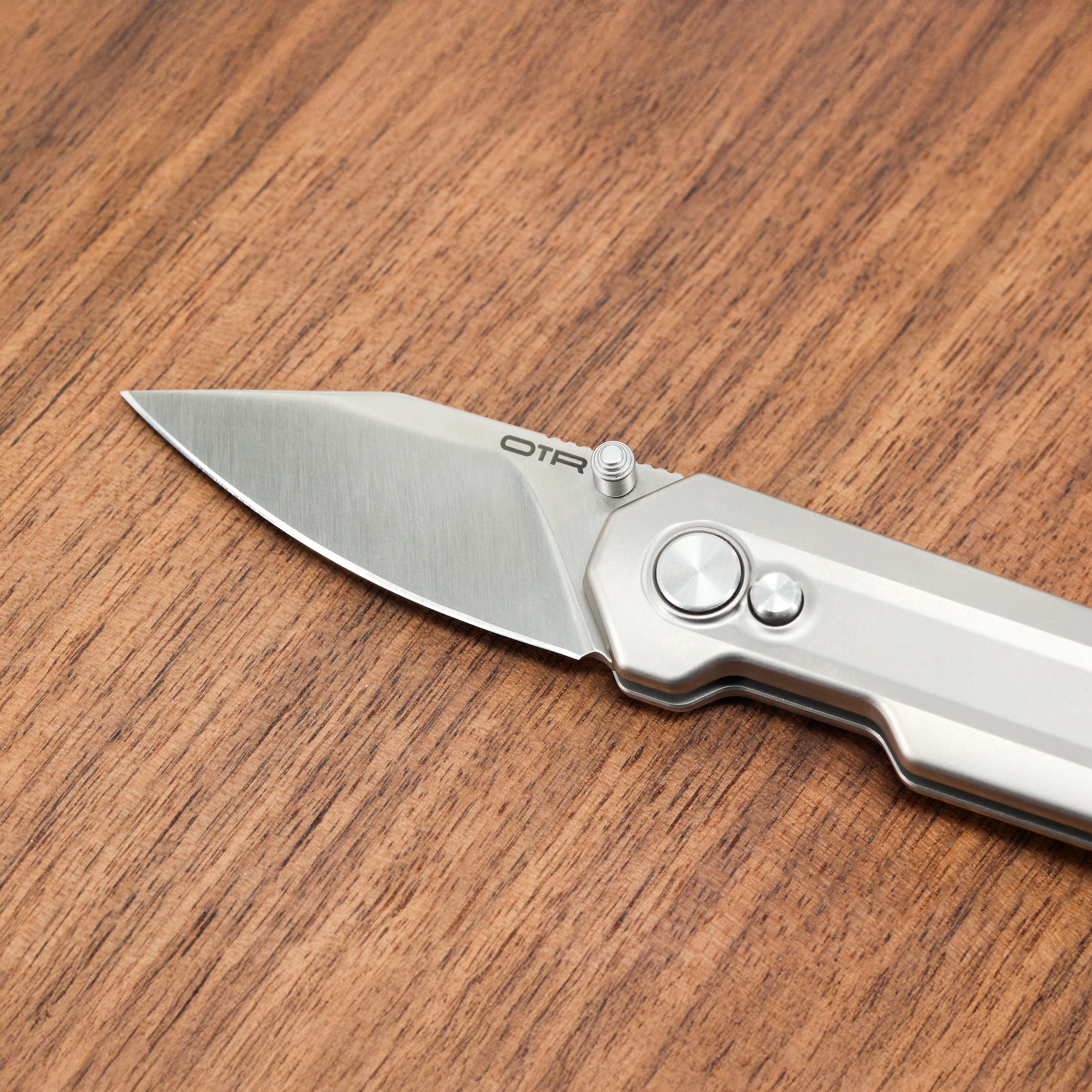 Mini Titanium Pocket Knife on Wood