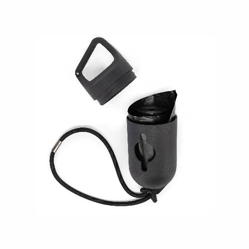 A black pet waste bag dispenser with a carrying strap and a separate black cap